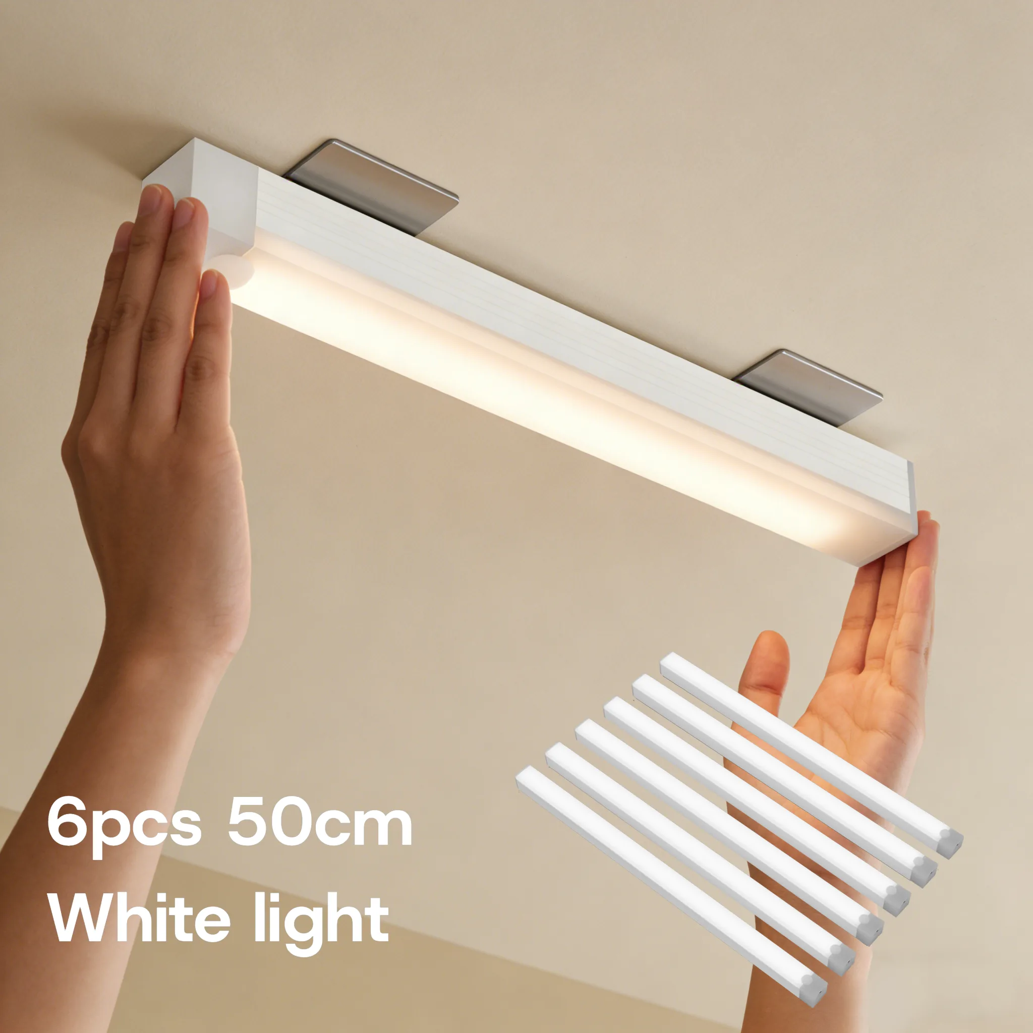 Cool white 50 cm 6-pack light bars installed under a kitchen cabinet, with a 6-piece inset
