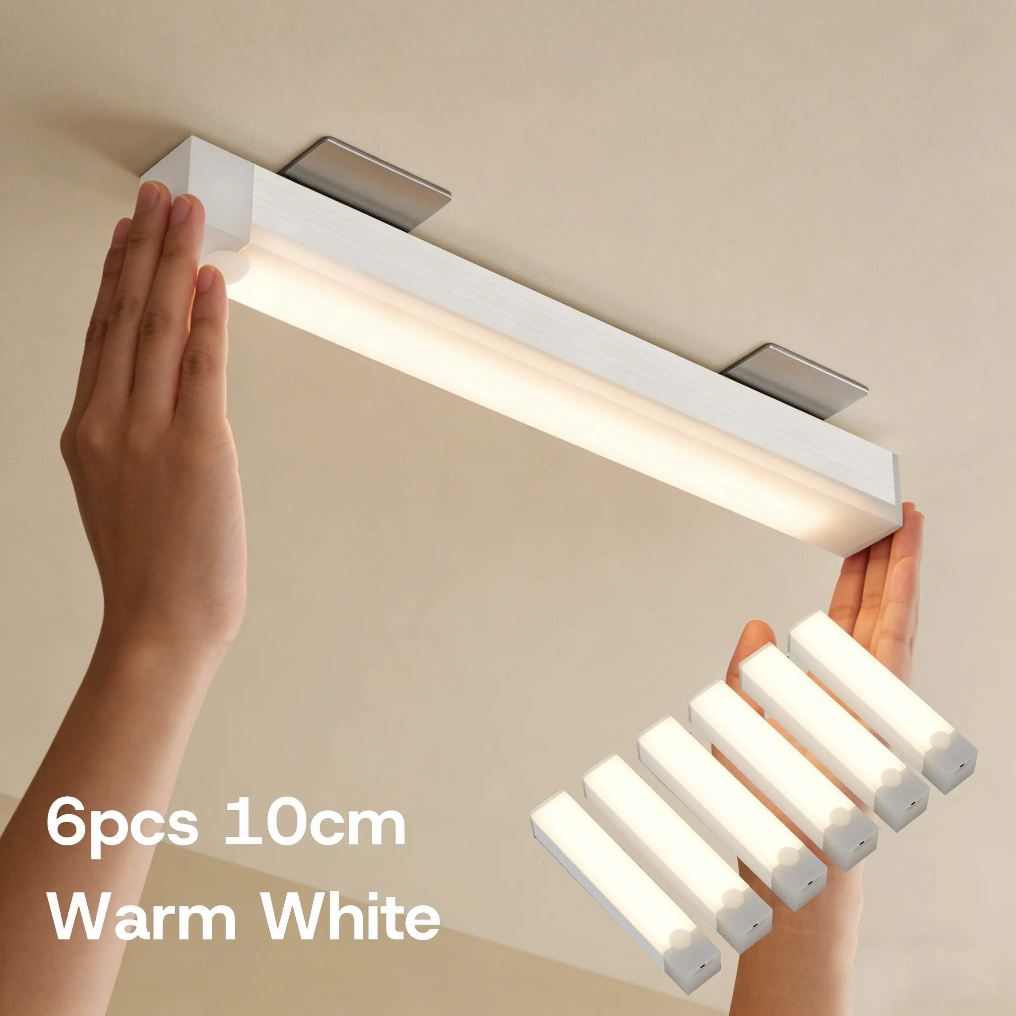 Warm white 10 cm 6-pack light bars installed under a kitchen cabinet, with a 6-piece inset